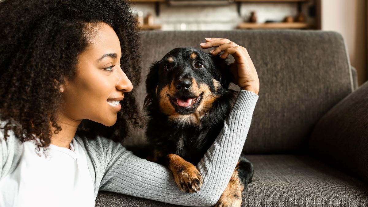 close up of young woman and her dog